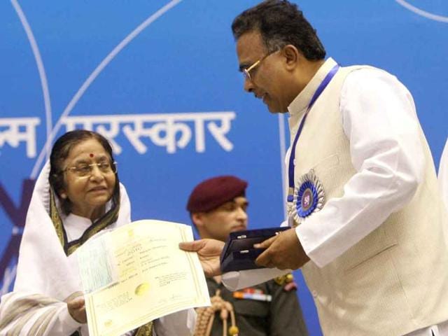 President Pratibha Patil presents Best Children's Film Award to director PR Ramadasa Naidu for his film "Hejjegalu" during the '58th National Film Awards Function' in New Delhi.