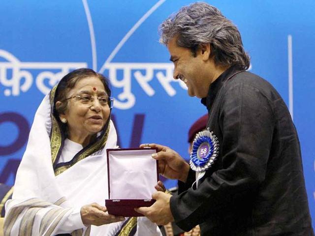 President Pratibha Patil presents the Best Music Direction (Songs) award to Vishal Bhardwaj during the '58th National Film Awards Function' in New Delhi.