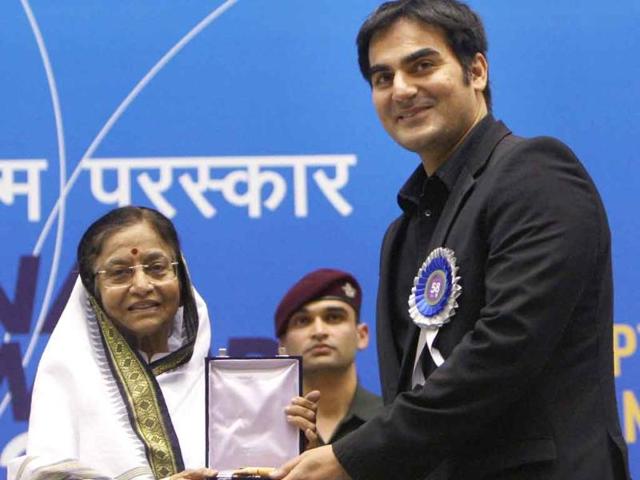 President Pratibha Patil presents the award for Best Popular Film providing wholesome entertainment to Producer-actor Arbaaz Khan for his film Dabangg during the '58th National Film Awards Function' in New Delhi.