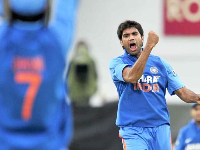 Munaf Patel celebrates taking the wicket of England's Alastair Cook during the third one day cricket match between England and India at The Oval, London.
