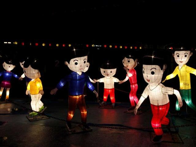 Children-shaped lanterns are displayed as part of the celebration of the upcoming Mid-Autumn festival in Hong Kong.