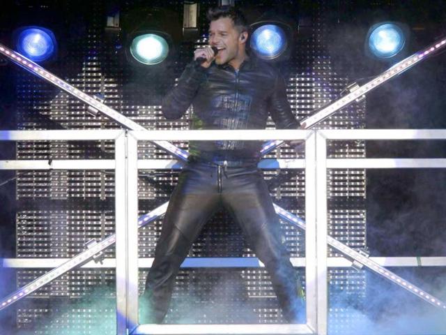 Puerto Rican pop singer Ricky Martin performs during his M.A.S. Tour in Asuncion.
