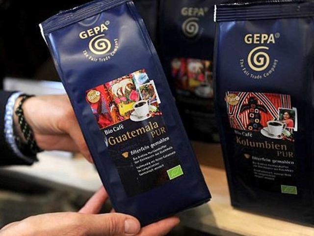 A hand holds a box with coffee from Guatemala pictured in Dortmund, western Germany, during the "Fair 2011" an exhibition for fair trade.