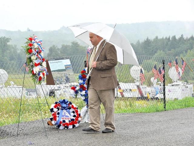 A man looks at wreaths near the field where United flight 93 crashed in Shanksville Pensylvania.