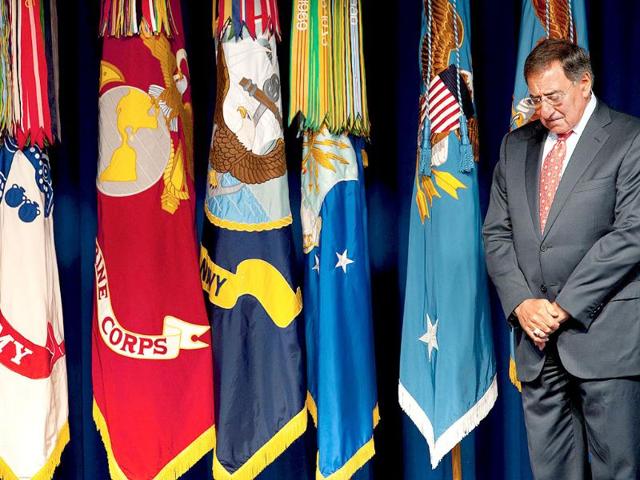 US secretary of defense Leon Panetta bows his head during ceremonies remembering the 911 anniversary and highlighting the National 911 Flag inside the center courtyard of the Pentagon.
