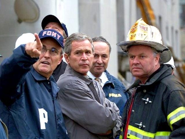 The then US President George W Bush surveys the damage at the site of the World Trade Center with New York Mayor Giuliani and a New York City Fire Department Official 14 September 2001 in New York. File photo