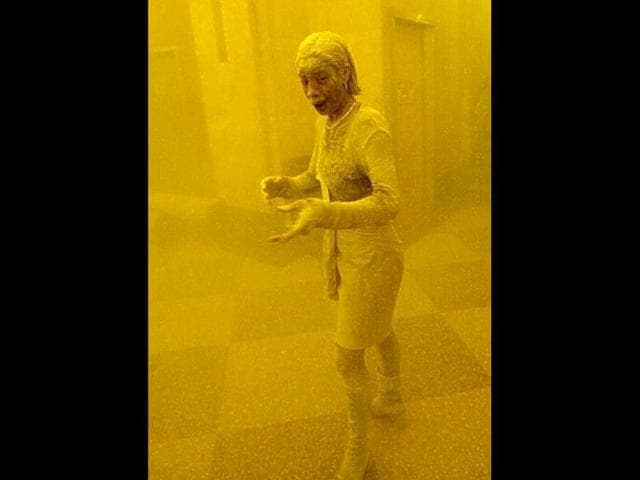 Marcy Borders covered in dust as she takes refuge in an office building after one of the World Trade Center towers collapsed in New York on September 11, 2001. File photo
