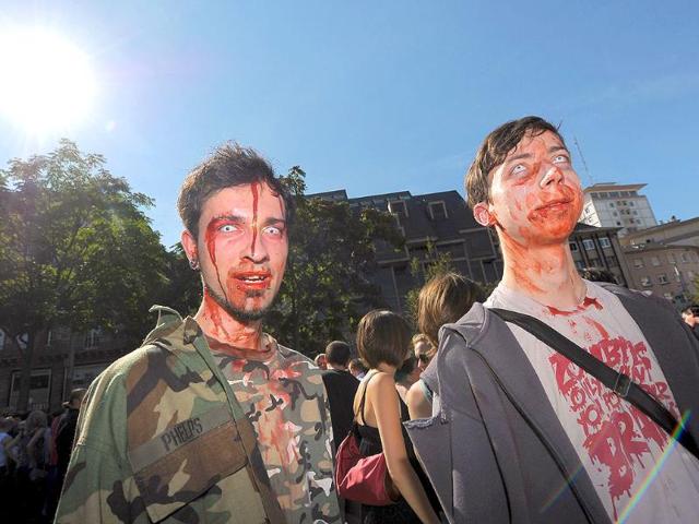 People dressed up as zombies take part in the Zombie Walk event on September 10, 2011 in the French eastern city of Strasbourg, before the opening of the fourth edition of the European Fantastic Film festival.