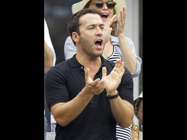 Jeremy Piven waits for the start of a semifinal match at the US Open tennis tournament in New York. AP