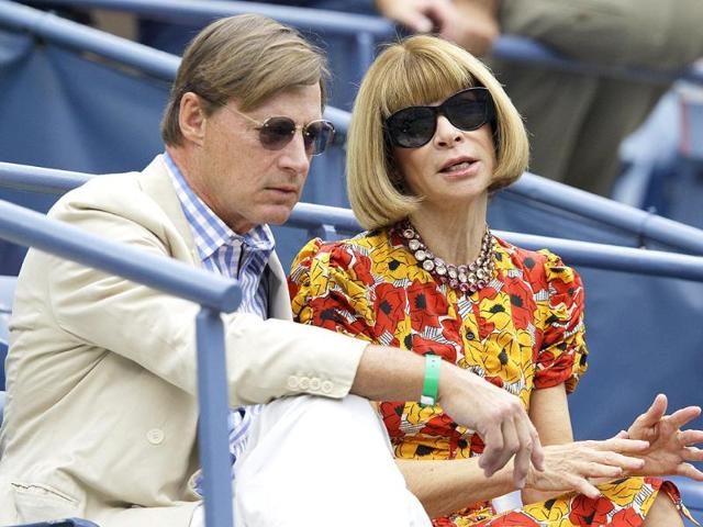 Vogue editor-in-chief Anna Wintour, right, waits with a guest for the start of a semifinal match at the US Open tennis tournament in New York.