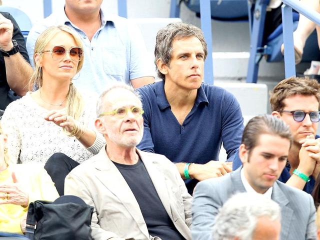 Actor Christine Taylor, her husband actor Ben Stiller, actor Bradley Cooper and actor Ron Rifkin watches Roger Federer and Novak Djokovic during the Men's semifinal 2011 US Open match.