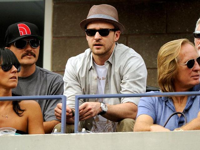 Singer Justin Timberlake watches the men's semifinal match between Novak Djokovic and Roger Federer during the 2011 US Open.