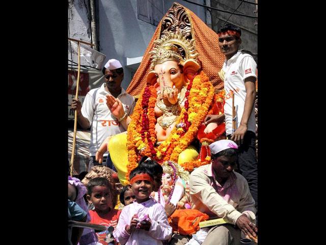 An idol of Hindu god Ganesh is taken for immersion in River Tawi in Jammu.