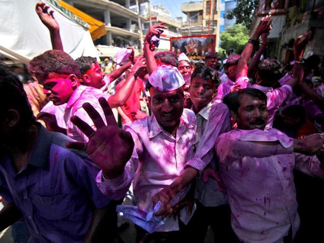 Devotee dance as they participate in a procession to immerse idols of elephant-headed Hindu God Ganesha in the River Tawi during Ganesh Chaturthi festival in Jammu.