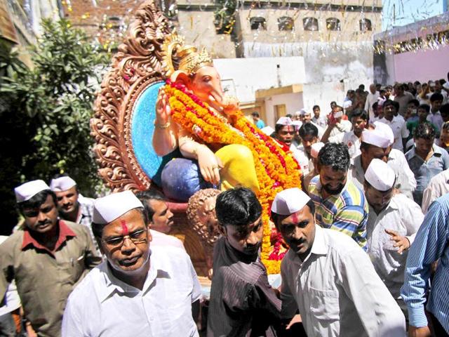 Devotees carry an idol of elephant-headed Hindu God Ganesha for immersion in the River Tawi during Ganesh Chaturthi festival in Jammu.