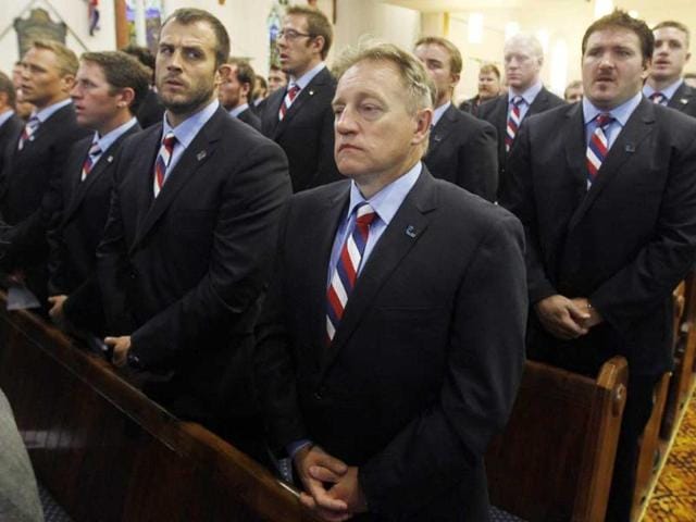 Coach of the US rugby team Eddie O'Sullivan (C) and players attend a special service to commemorate the 10th anniversary of the September 11 terrorist attacks, at a church in New Plymouth, New Zealand.