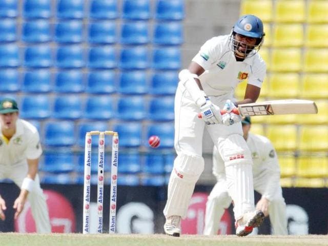 Sri Lankan cricketer Tharanga Paranavitana (C) plays a shot during the fourth day of the second Test match against Australia in Pallekele.