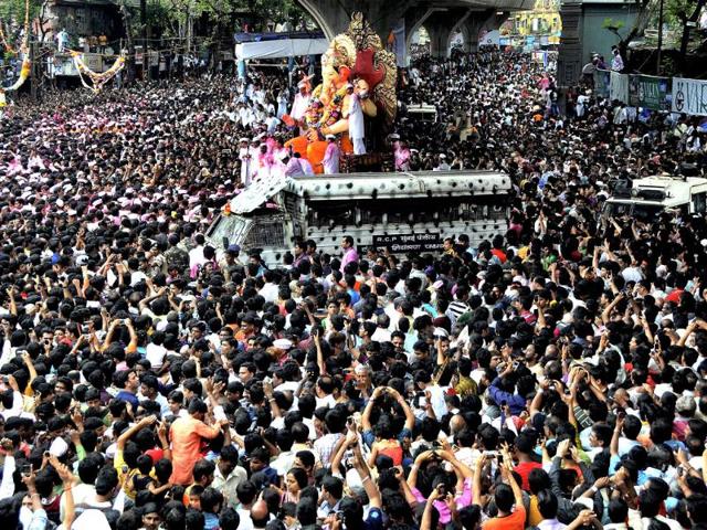 A huge crowd of devotees with Ganesh idol on the way for immersion at Girgaum Chowpatty at the end of the ten day long Ganesh festival, in Mumbai.