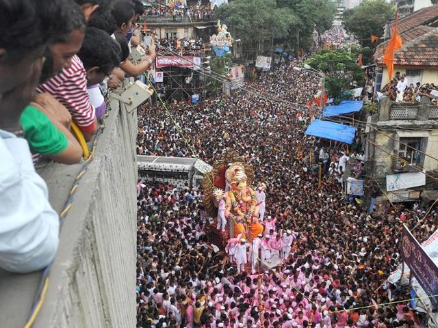 Devotees carry an idol of Lord Ganesha, the deity of prosperity, during a procession before immersing it in the waters of the Arabian Sea on the last day of the Ganesh Chaturthi festival in Mumbai.