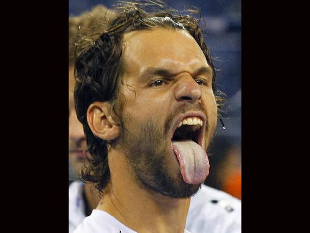 Philipp Petzschner of Germany sticks his tongue out towards his friends after he and Jurgen Melzer of Austria defeated Mariusz Fyrstenberg and Marcin Matkowski of Poland 6-2, 6-2 in the men's doubles final at the US Open tennis tournament in New York.