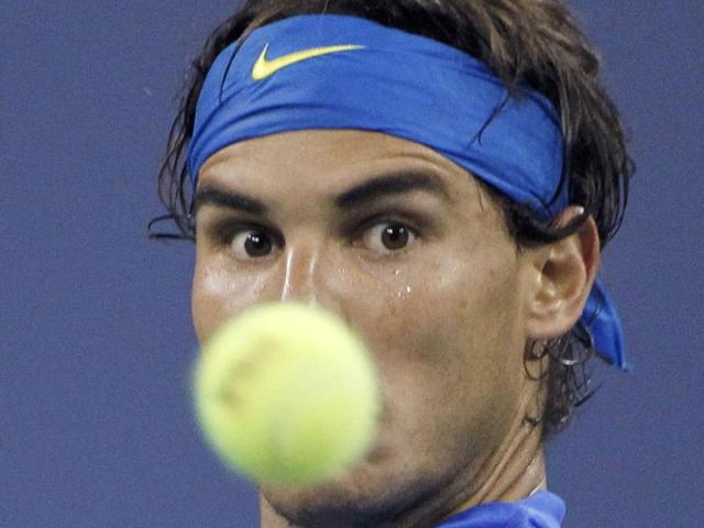 Spanish tennis player Rafael Nadal serves a shot to Great Britain's Andy Murray during their Men's US Open 2011 semifinals match at the USTA Billie Jean King National Tennis Center in New York.