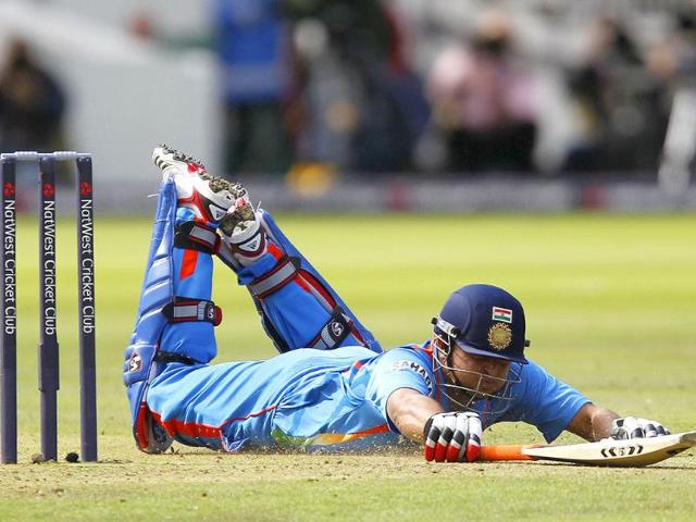 India's Suresh Raina dives to avoid being run out and is successful during the fourth One Day International (ODI) cricket match between England and India at Lord's cricket ground in London.