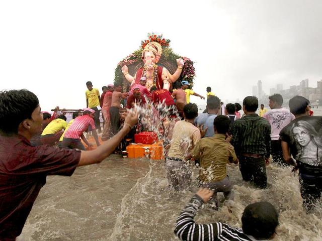 Devotees carry an idol of Hindu God Ganesh during a procession to immerse it in the Arabian Sea at the end of the ten day festival in Mumbai.