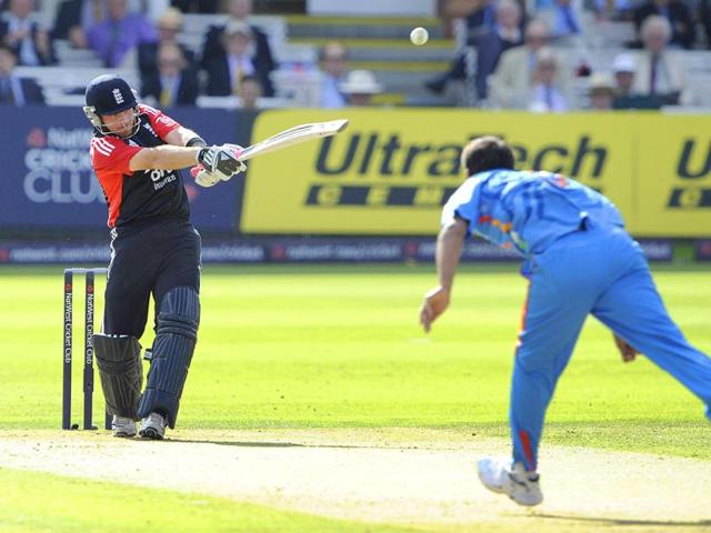 England's Ian Bell, left, hits a ball from India's Praveen Kumar, right, during their One Day International cricket match at Lord's cricket ground, London.