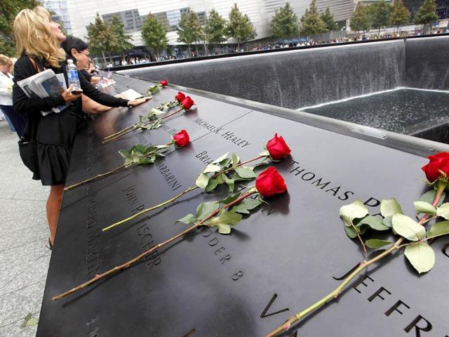 Family members of victims of the 9/11 attacks on the World Trade Center visit the South Pool during ceremonies marking the 10th anniversary in New York, September 11, 2011.