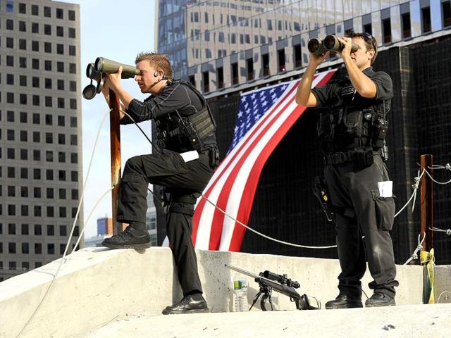 Secret Service snipers keep watch from the roof of the Sept. 11 Memorial Museum during the ceremony to mark the 10th anniversary of the attacks on the World Trade Center in New York Sunday, Sept. 11, 2011.
