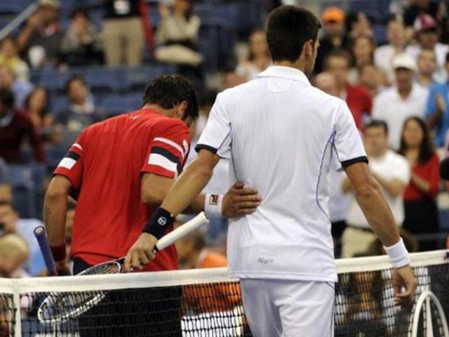 Novak Djokovic hugged it out with Davis Cup teammate Janko Tipsarevic after Tipsarevic withdrew in the 4th set in their US Open quarterfinal match, making way for Djokovic's semis clash with Federer.