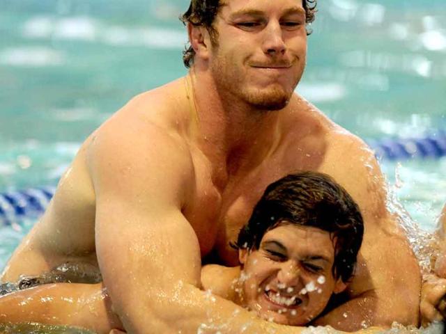 Australian Wallabies players David Pocock (top) and Rob Simmons (below) have fun during a team recovery session at the 2011 Rugby World Cup in Auckland.