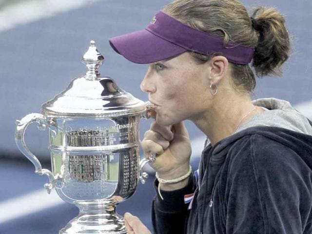 Samantha Stosur of Australia kisses the championship trophy after beating Serena Williams at the US Open tennis tournament in New York.