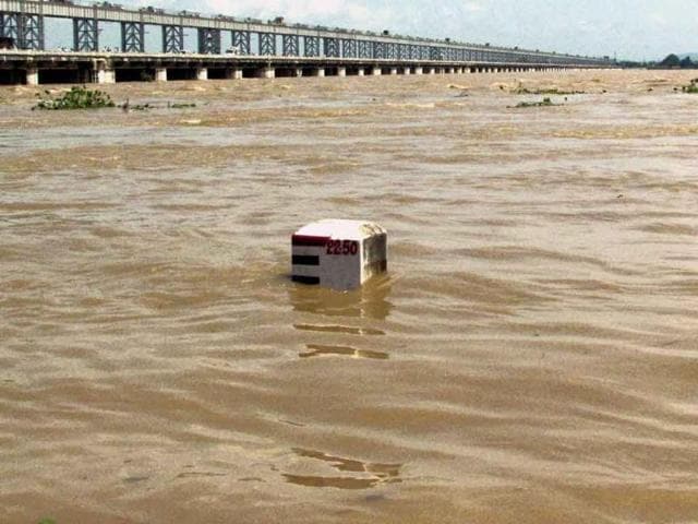 A view of the swollen Mahanadi river flowing above the danger mark near Mundali in Cuttack.