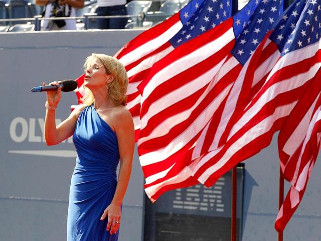 Kelli O'Hara sings the national anthem before the men's championship match between Rafael Nadal of Spain and Novak Djokovic of Serbia at the US Open tennis tournament.