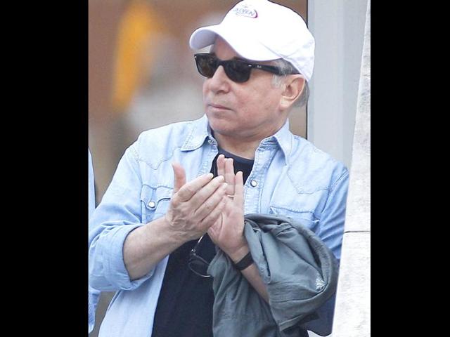 Paul Simon waits for the start of the men's championship match between Rafael Nadal of Spain and Novak Djokovic of Serbia at the US Open tennis tournament in New York.