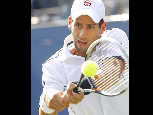 Novak Djokovic returns a shot to Rafael Nadal during the men's championship match at the US Open tennis tournament in New York.