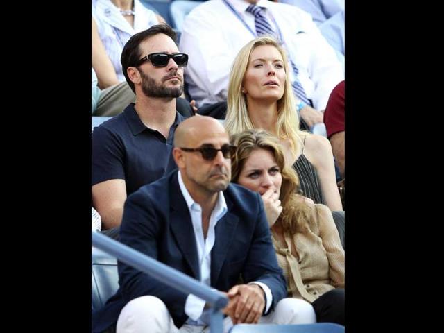 NASCR driver Jimmie Johnson and his wife Chandra watch Rafael Nadal of Spain play against Novak Djokovic of Serbia during the men's US Open final at the USTA Billie Jean King National Tennis Center in New York City.