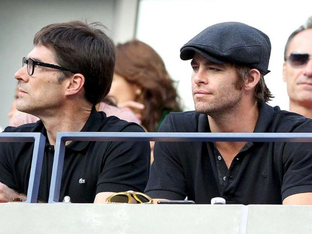 (L-R) Actors Thomas Gibson and Chris Pine watch Rafael Nadal versus Novak Djokovic US Open 2011 men's final at the USTA Billie Jean King National Tennis Center in New York City.