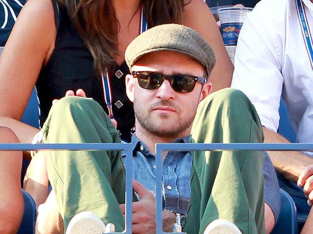 Actor Justin Timberlake watches Rafael Nadal play against Novak Djokovic during the men's US Open 2011 final at the USTA Billie Jean King National Tennis Center in New York City.