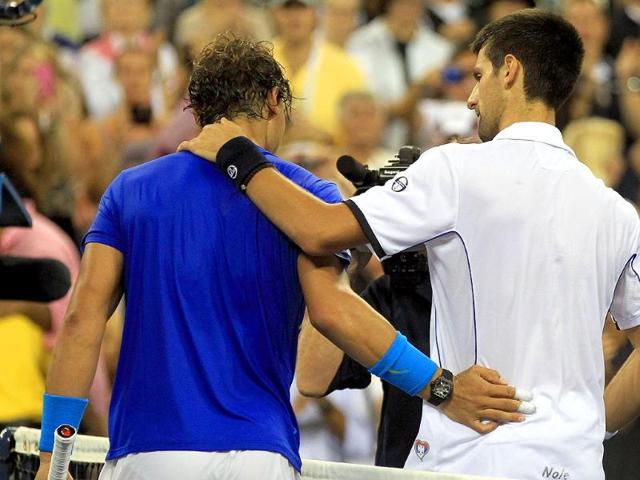 Rafael Nadal congratulates Novak Djokovic after the Serb won the men's US Open 2011 final at the USTA Billie Jean King National Tennis Center in New York City.
