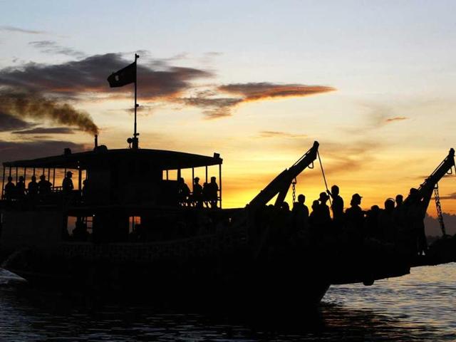 Cambodian passengers cross the Mekong river by ferry at a port in Phnom Penh, Cambodia.