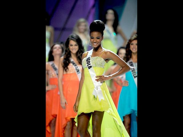 Miss Angola is seen in a lemon yellow dress as she participates in the the 60th Miss Universe beauty pageant.