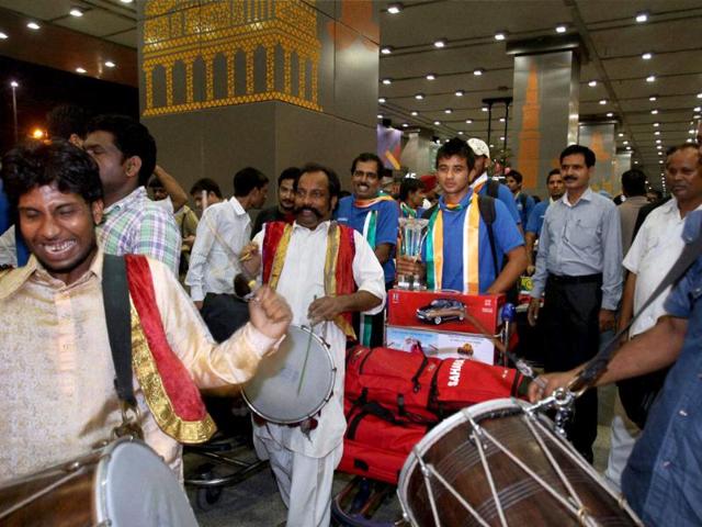 The Indian hockey team is welcomed by drummers upon their arrival at the IGI Airport.