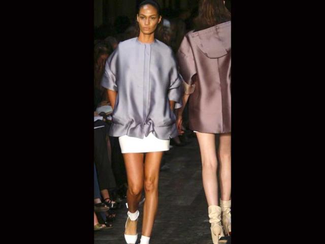 Victoria uses satin for a baggy formal look.
