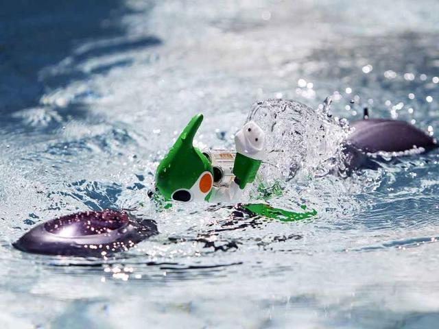Panasonic's Evolta swim robot, powered by the company's Evolta rechargable batteries, is demonstrated at a pool after a news conference in Tokyo.