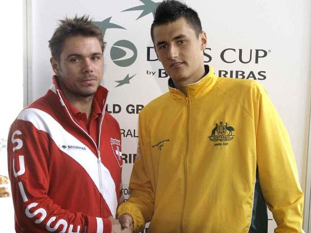 Swiss tennis player Stanislas Wawrinka (L) shakes hands with Australia's Bernard Tomic after they were drawn to play each other in their first matches of their Davis Cup world play-off in Sydney.