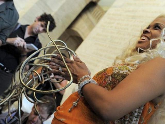 Chris "The Dutchess" Walton shows off her fingernails that total 19 feet 9 inches (6.02 meters) in length at the New York Public Library, setting a record that puts her in the new Guinness World Records 2012 book.