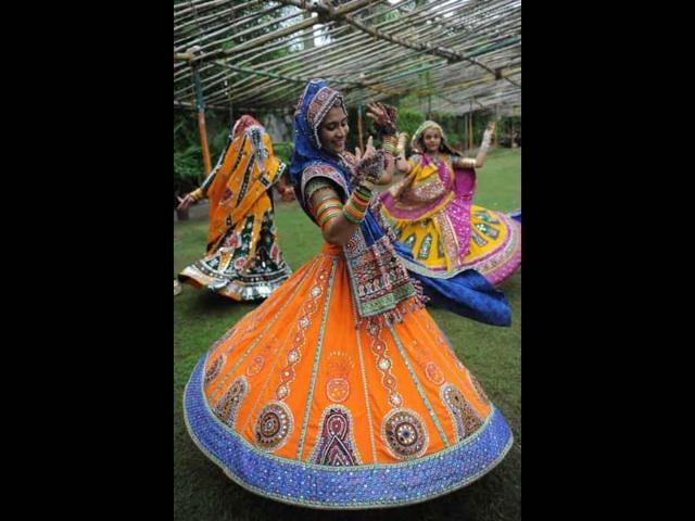 Indian folk dancers perform during a full dress rehearsal for the forthcoming Navratri festivities.