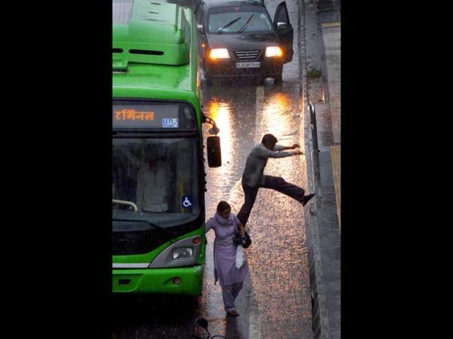 People caught in the rain in New Delhi were compelled to attempt some stunts.